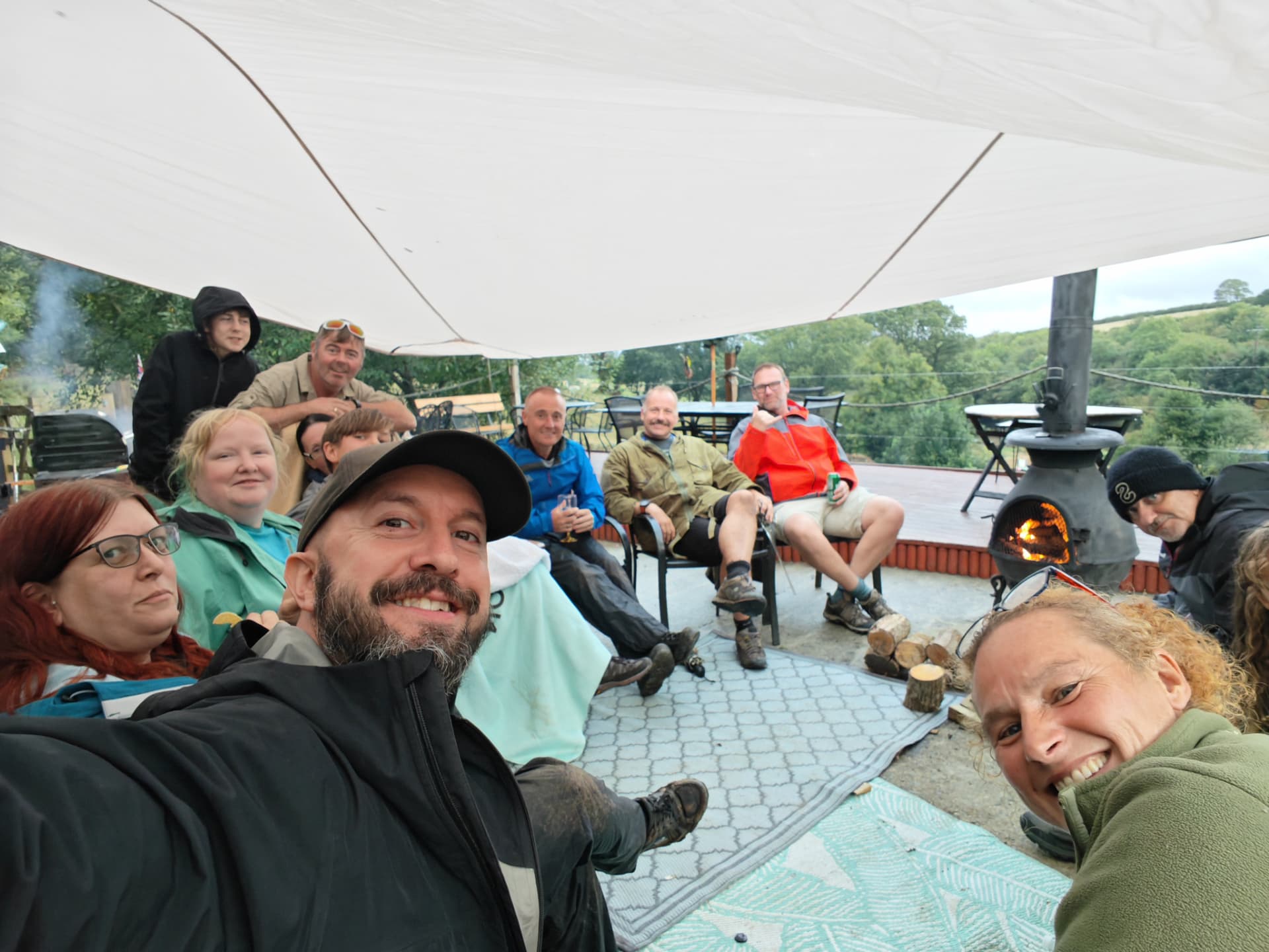 Course group relaxing together under a canopy after a day of TreeNet training